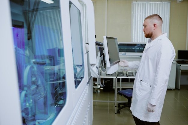 A scientist in a lab coat using advanced equipment to perform gene editing, focusing on the CRISPR-Cas9 system, with a digital display visualizing the DNA sequence and the editing process in real-time.