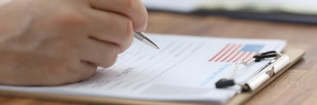 A close-up image of a US Department of Veterans Affairs document highlighting the section on disability compensation benefits, with a pen resting on the page, signifying attentive review and planning.