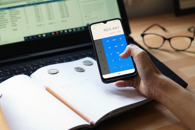 A detailed close-up of a smartphone screen displaying an AI-powered budgeting app interface, showcasing visualizations of spending categories, personalized recommendations, and predictive budgeting features.