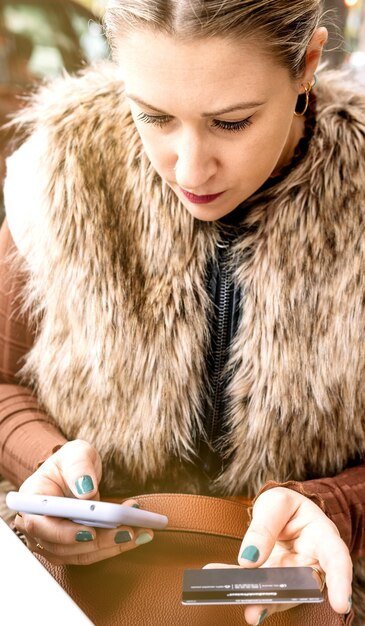 A person using a mobile banking app or website on their smartphone to track their student loan payments and budget. The interface is clean and user-friendly, showcasing modern tools for financial management.