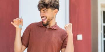 Young Arabian handsome man holding home keys at outdoors celebrating a victory